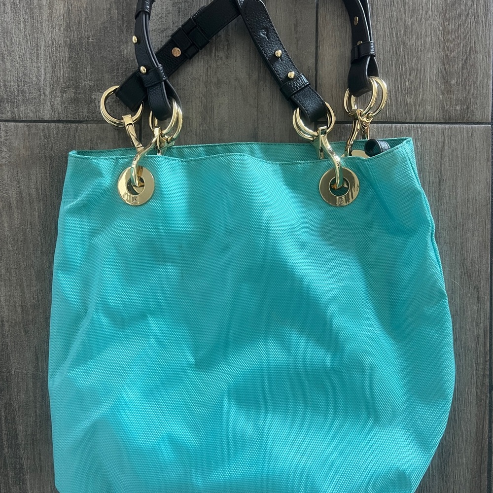 JPK tote with gold hardware and leather details